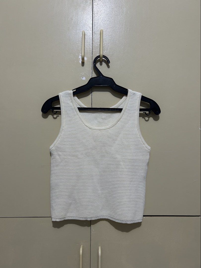 White Waffle Knit Tank Top (Category: Sleeveless) located in San Pedro. Submitted by annasant.s (Listing ID 1458748399, Image 1). Description: - Basic white tank top - Waffle knit texture - Sleeveless design - Ideal for layering or wearing solo - Comfortable and casual fit - Fits true to size.