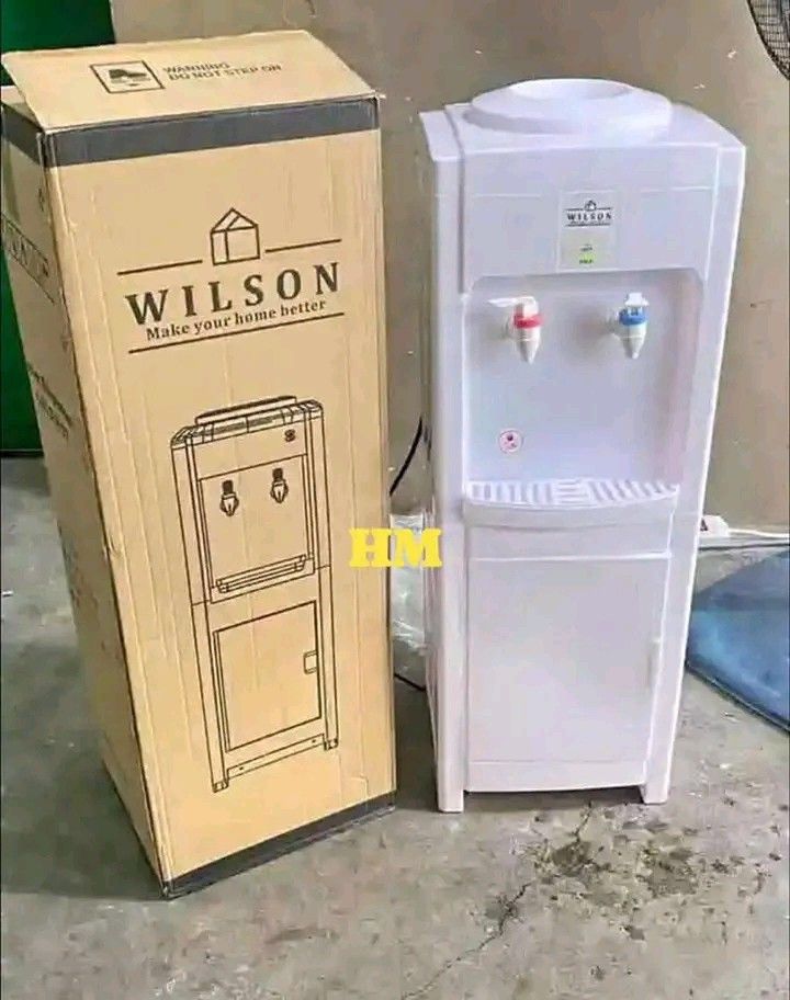 Wilson Water Dispenser Hot and Cold (Category: Water Purifiers & Dispensers) located in Manila. Submitted by berdenmarl01688 (Listing ID 1458874752, Image 2). Description: - White Wilson water dispenser - Features both hot and cold water taps - Convenient bottom storage compartment - Comes with its original packaging - Ideal for both home and office environments.