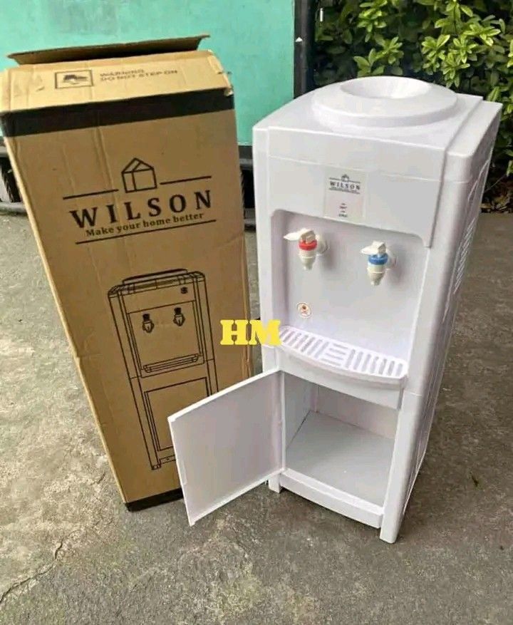 Wilson Water Dispenser Hot and Cold (Category: Water Purifiers & Dispensers) located in Manila. Submitted by berdenmarl01688 (Listing ID 1458874752, Image 1). Description: - White Wilson water dispenser - Features both hot and cold water taps - Convenient bottom storage compartment - Comes with its original packaging - Ideal for both home and office environments.
