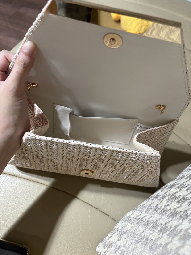 Woven Envelope Clutch Bag with Gold Clasp (Category: Clutches) located in Makati City. Submitted by panikki (Listing ID 1458704403, Image 2). Description: - Cute woven clutch bag - Natural straw-like material with chevron pattern - Gold metal accent on flap closure - Interior small pocket - Magnetic snap closure - Ideal for evenings out or special occasions Used once for an event .