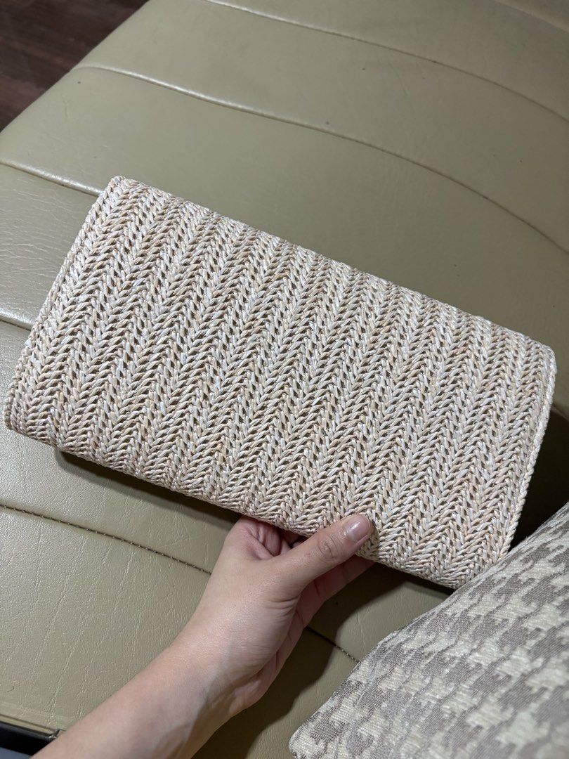 Woven Envelope Clutch Bag with Gold Clasp (Category: Clutches) located in Makati City. Submitted by panikki (Listing ID 1458704403, Image 3). Description: - Cute woven clutch bag - Natural straw-like material with chevron pattern - Gold metal accent on flap closure - Interior small pocket - Magnetic snap closure - Ideal for evenings out or special occasions Used once for an event .