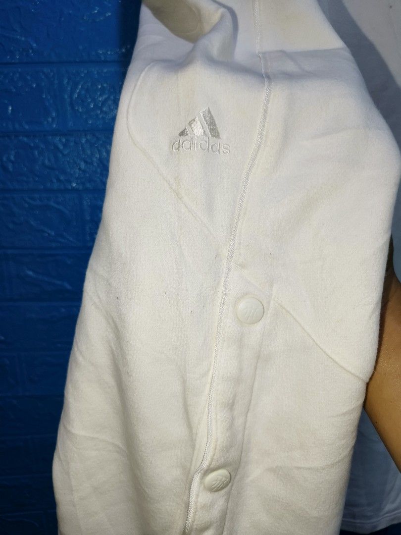 Y2k Adidas TMAC White Snap Button Track Pants Size M (Category: Joggers) located in Davao. Submitted by vndrgd (Listing ID 1458802688, Image 2). Description: - White Adidas TMAC track pants - Size: Medium (fits waist 30-34 inches) - Measurements: Length 41 inches, Hem 10.5 inches - Features: Snap buttons down the sides - Condition: Minor marks on fabric (please check photos) - Ideal for: Casual wear or sports.