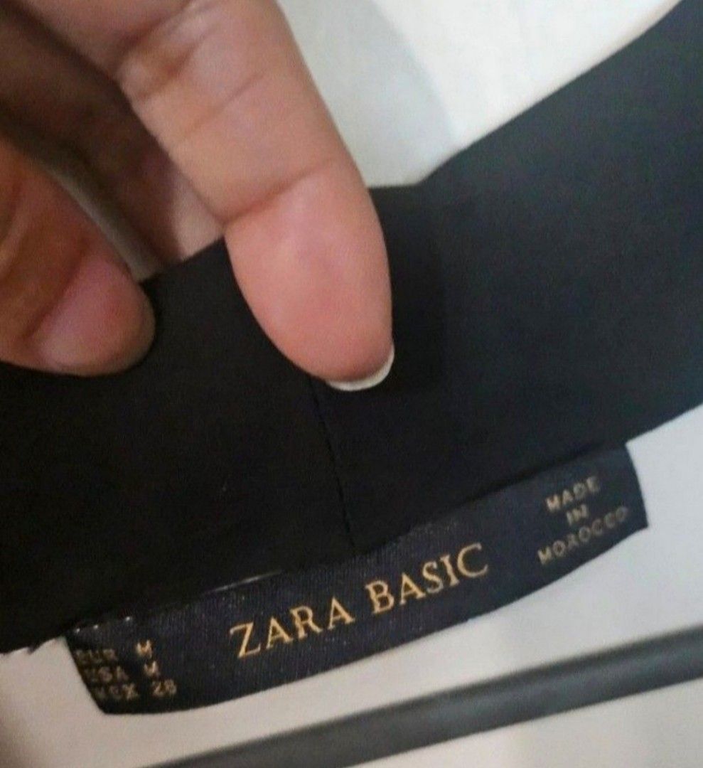 Zara Basic White Long Sleeve Blouse with Black Collar and Tie (Category: Blouses) located in Quezon City. Submitted by kcobs (Listing ID 1458834546, Image 3). Description: - White long-sleeved blouse from Zara Basic - Features a contrasting black collar - Front tie detail - Subtle pleats on the back - Perfect for dressing up or down - Ideal for work or casual outings.