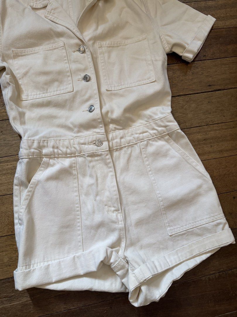 ZARA Cream Utility Short Jumpsuit (Category: Jumpsuits) located in Cebu City. Submitted by shopvictoriaa (Listing ID 1458727064, Image 3). Description: - Zara cream utility short jumpsuit - Short sleeves with rolled cuffs - Button-up front with two chest pockets - Elasticated waist for a comfortable fit - Cuffed shorts - Ideal for everyday casual wear - (my waistline 29-30, Bust 34B).