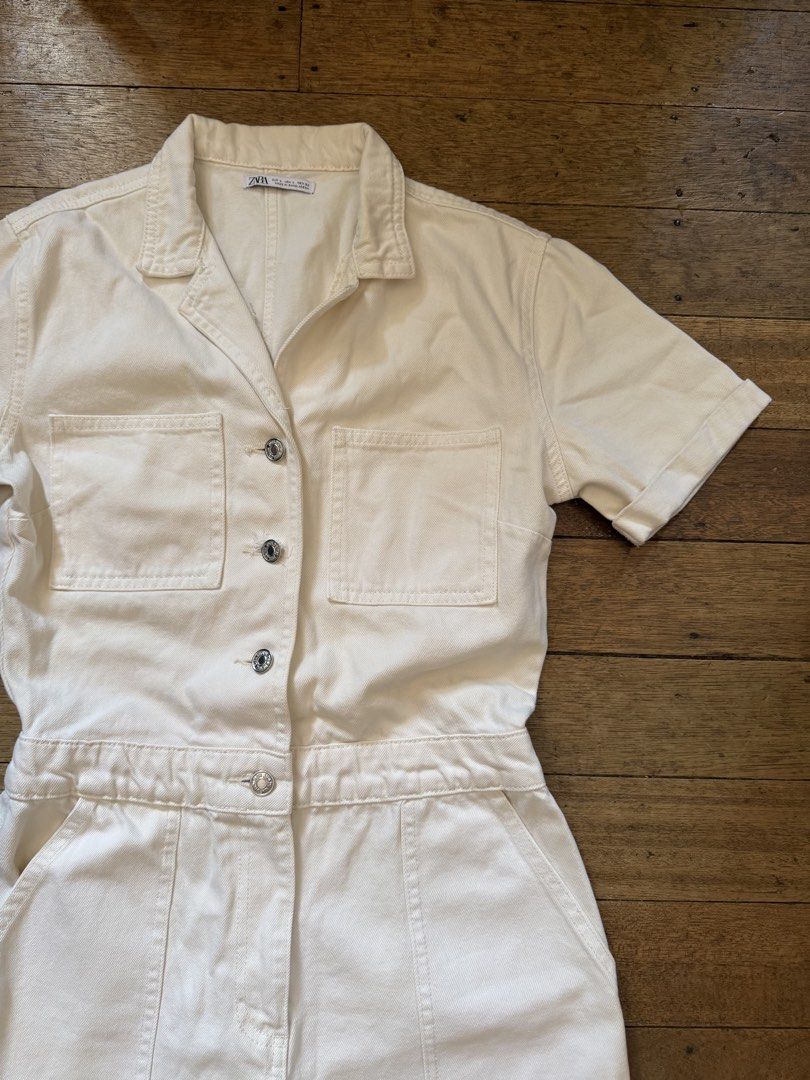 ZARA Cream Utility Short Jumpsuit (Category: Jumpsuits) located in Cebu City. Submitted by shopvictoriaa (Listing ID 1458727064, Image 2). Description: - Zara cream utility short jumpsuit - Short sleeves with rolled cuffs - Button-up front with two chest pockets - Elasticated waist for a comfortable fit - Cuffed shorts - Ideal for everyday casual wear - (my waistline 29-30, Bust 34B).
