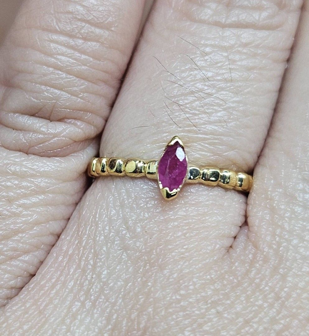 14K Pawnable gold dainty bubble ring with marquise cut ruby stone (Category: Rings) located in Cebu City. Submitted by isaira (Listing ID 1453724572, Image 2). Description: - 14K pawnable gold (1.5 grams) - size 4 & 1/2 but can be resize with extra charge - Features a marquise-cut ruby center stone - Dainty band with half bubble texture - Perfect for stacking or solo wear.