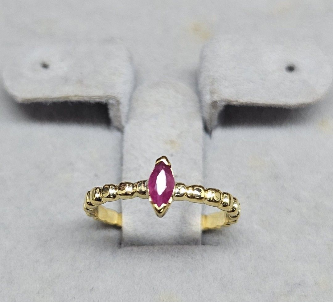 14K Pawnable gold dainty bubble ring with marquise cut ruby stone (Category: Rings) located in Cebu City. Submitted by isaira (Listing ID 1453724572, Image 1). Description: - 14K pawnable gold (1.5 grams) - size 4 & 1/2 but can be resize with extra charge - Features a marquise-cut ruby center stone - Dainty band with half bubble texture - Perfect for stacking or solo wear.