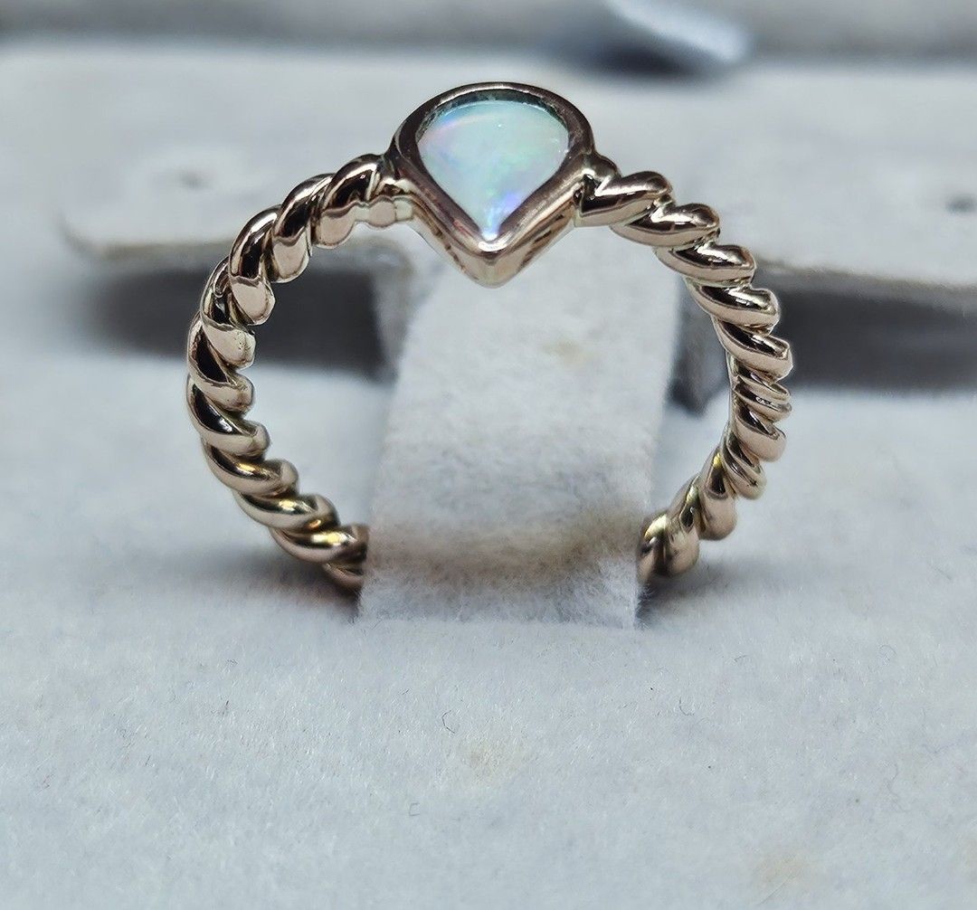 14K Rose Gold Twisted Band Pear Cut Opal Ring (Category: Rings) located in Cebu City. Submitted by isaira (Listing ID 1453725801, Image 1). Description: - 14k pawnable Rose Gold (2.4 grams) - size 5 & 1/2 - Cute pear-cut opal ring - Rose gold twisted band - Lovely iridescent shimmer - Great for stacking or wearing alone - Simple and dainty design - Perfect for everyday wear.