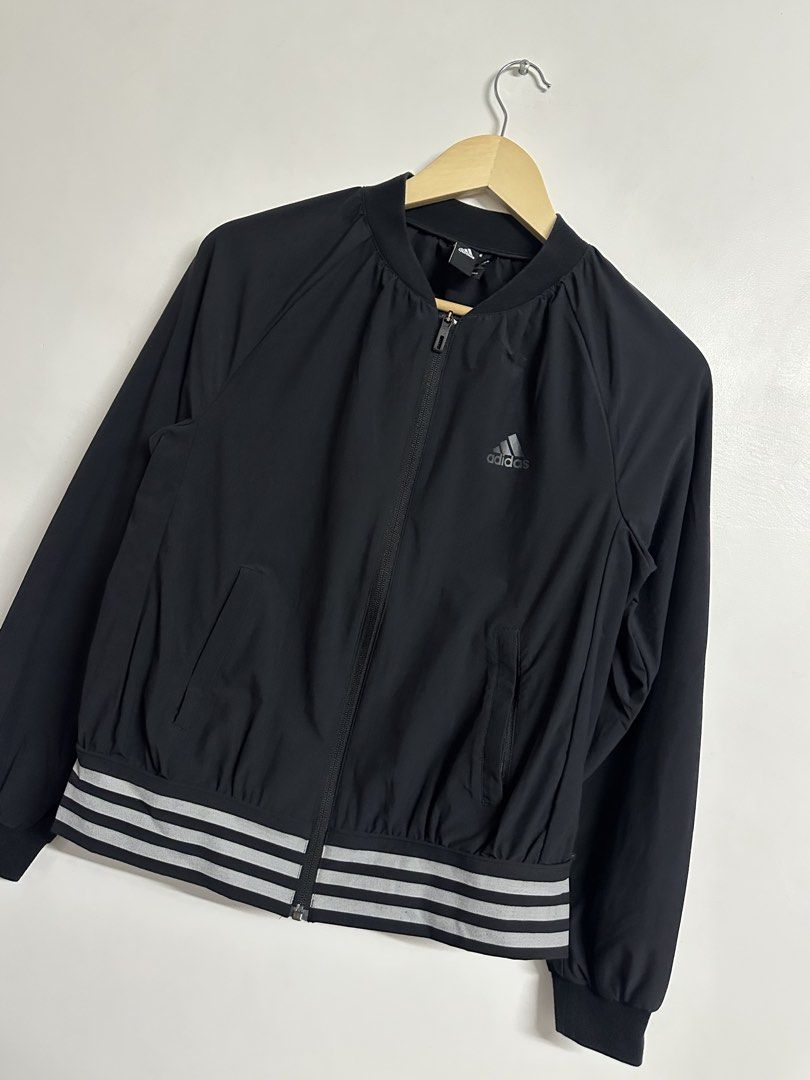 Adidas Black Bomber Jacket with Stripes (Category: Coats, Jackets and Outerwear) located in Manila. Submitted by madysss (Listing ID 1453779016, Image 2). Description: Bestfit: M-semi L - Classic Adidas bomber jacket - Iconic Adidas logo on chest - Ribbed cuffs and hem with signature stripes - Full zipper closure - Versatile for casual wear or light workouts.