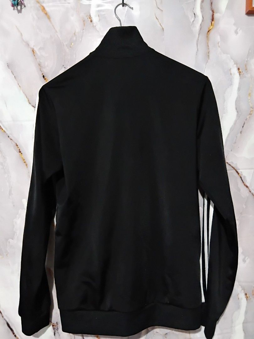 ADIDAS ESSENTIAL WARM UP 3 STRIPES TRACK JACKET (Category: Coats, Jackets and Outerwear) located in General Mariano Alvarez. Submitted by adonid (Listing ID 1453680889, Image 2). Description: ORIGINAL ADIDAS ESSENTIAL WARM UP 3 STRIPES TRACK JACKET GOOD CONDITION NORMAL SIGN OF USAGE ONLY. W34 L26.