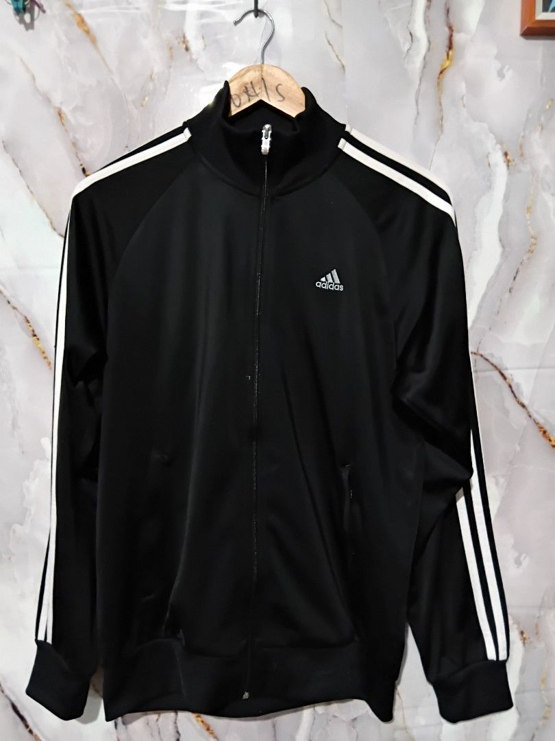 ADIDAS ESSENTIALS WARM UP 3 STRIPES TRACK JACKET (Category: Coats, Jackets and Outerwear) located in General Mariano Alvarez. Submitted by adonid (Listing ID 1453669355, Image 1). Description: ORIGINAL ADIDAS ESSENTIALS WARM UP 3 STRIPES TRACK JACKET GOOD CONDITION NORMAL SIGN OF USAGE ONLY. W36 L27.
