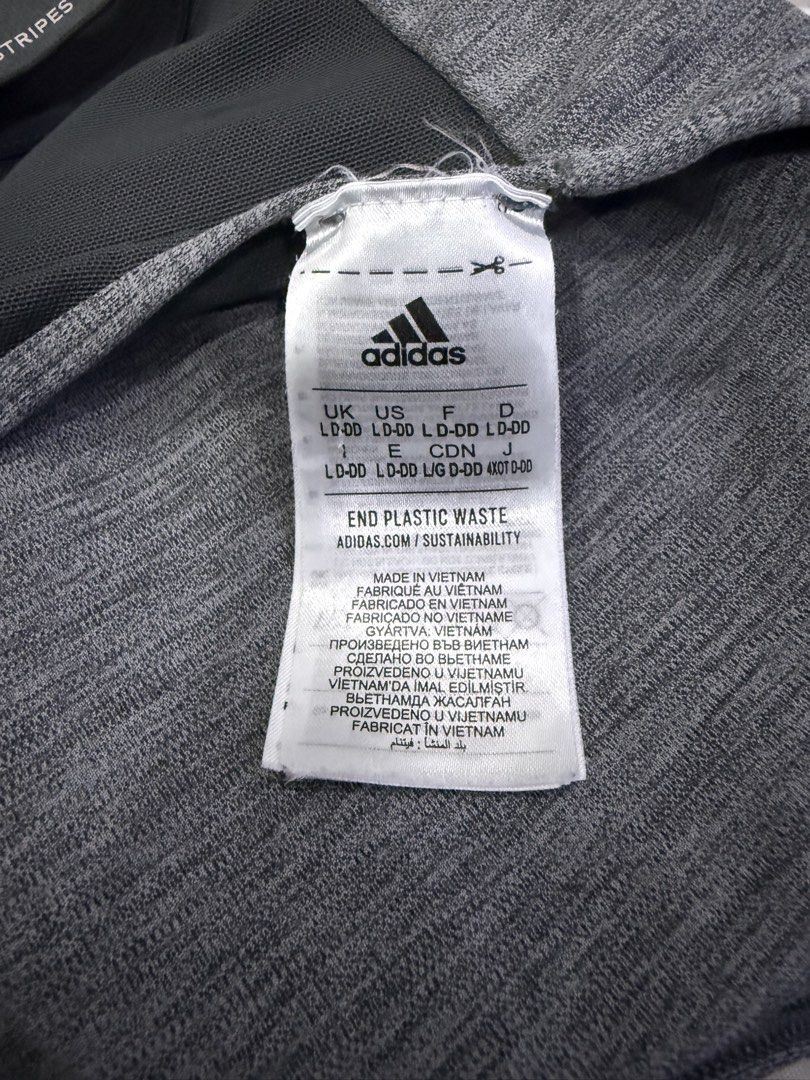 Adidas Grey Sports Bra (Category: Activewear) located in Quezon City. Submitted by nyancath (Listing ID 1453767093, Image 2). Description: Adidas grey heathered sports bra - Racerback design with mesh paneling for enhanced breathability - Elasticated band featuring repeating Adidas logo - Size: XL - Ideal for workouts or everyday comfort.