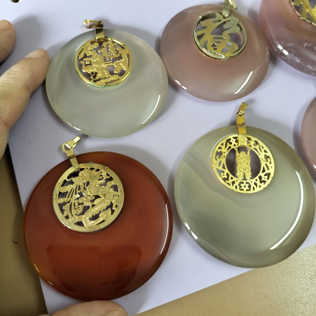 Agate Pendants with Gold Chinese Charms (Category: Charms) located in Paranaque City. Submitted by decluttering-all (Listing ID 1453628883, Image 2). Description: - Unique agate pendants with distinct colors. - Features gold charms with traditional Chinese designs (dragons, 'fortune' character). - Smooth, polished finish for a premium feel. - Includes a gold bail for easy attachment to chains or cords. - Ideal for adding a personal and stylish to