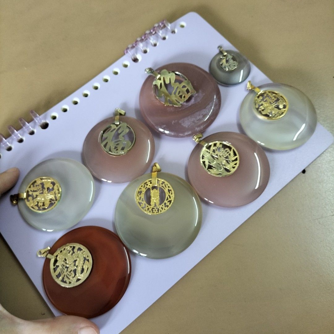 Agate Pendants with Gold Chinese Charms (Category: Charms) located in Paranaque City. Submitted by decluttering-all (Listing ID 1453628883, Image 1). Description: - Unique agate pendants with distinct colors. - Features gold charms with traditional Chinese designs (dragons, 'fortune' character). - Smooth, polished finish for a premium feel. - Includes a gold bail for easy attachment to chains or cords. - Ideal for adding a personal and stylish to