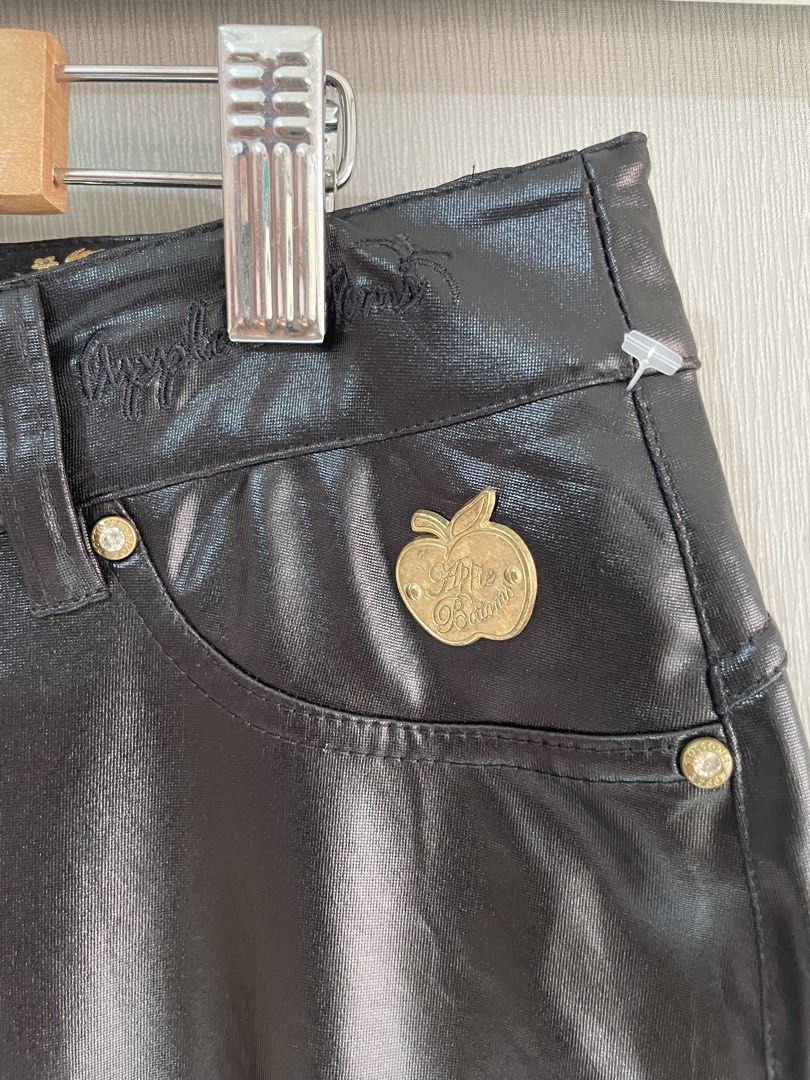 Apple Bottoms Black Faux Leather Pants (Category: Other Bottoms) located in Mataasnakahoy. Submitted by zero4thrift (Listing ID 1453629497, Image 3). Description: - Brand: Apple Bottoms - Material: Faux Leather - Color: Black - Fit: Straight Leg - Details: Gold button accents, embroidered logo on back pockets - Features: Nice sheen, statement piece .