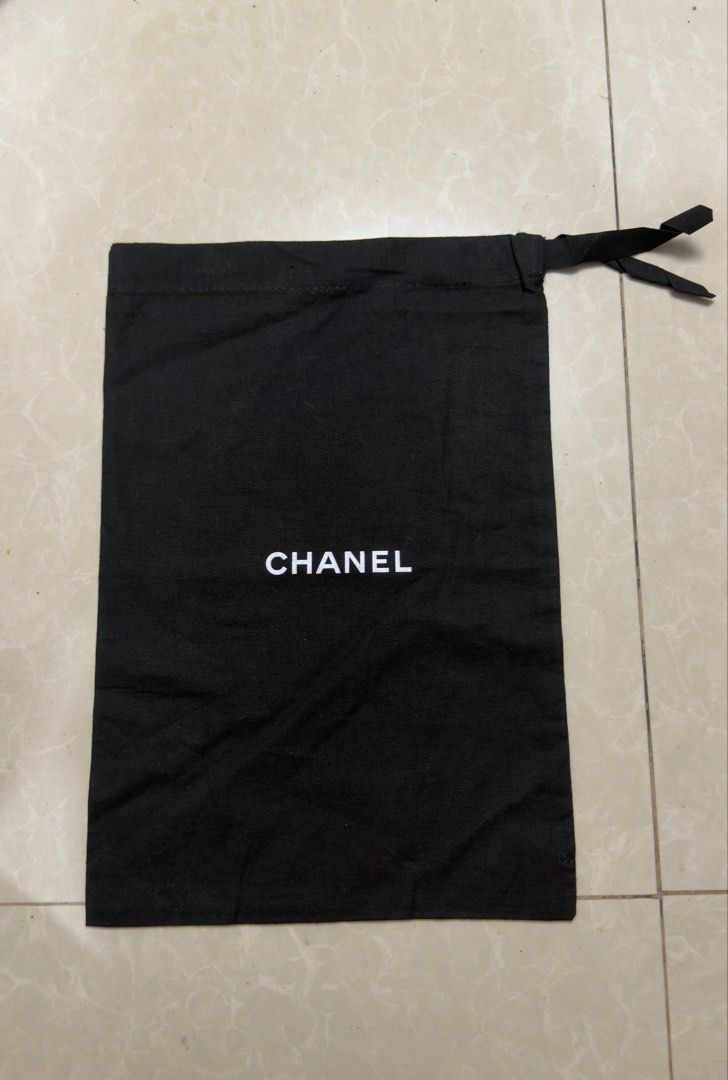 authentic Chanel Black Dust Bag (Category: Luxury Bags & Wallets) located in Manila. Submitted by tepohj888 (Listing ID 1453777826, Image 1). Description: Authentic Chanel dust bag Black fabric with white Chanel logo Drawstring closure Approx. 14 inches tall x 9.5inches wide Perfect for storing shoes or small accessories Clean and ready .