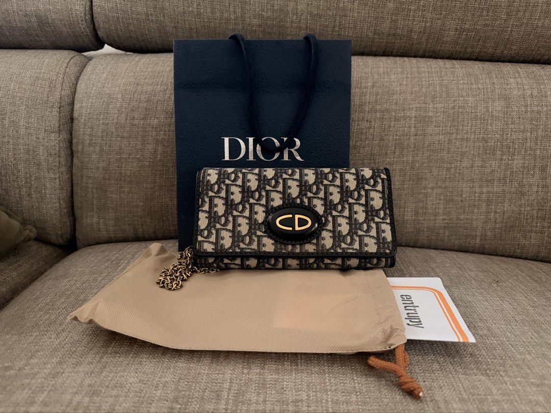 Authentic Christian Dior Oblique Wallet on Chain (Category: Luxury Bags & Wallets) located in Marikina City. Submitted by jecsq_ (Listing ID 1453648220, Image 1). Description: ✔ Authentic (Entrupy Certified) ✔ Purchased from Taiwan ✔ Comes with: * Entrupy Certificate * Original Taiwan boutique receipt * Official Taiwan invoice * Dust bag * Dior shopping bag ✔ Gold-tone hardware ✔ Excellent vintage condition ✔ Clean interior ✔ Chain included ✔ Mul