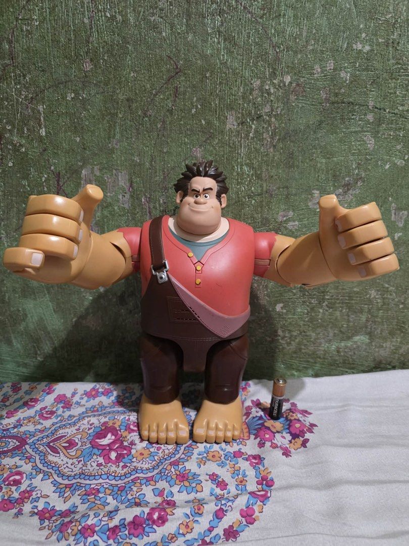 Authentic Disney Thinkway Wreck-It Ralph 11" Talking Action Figure (Category: Figurines & Statues) located in Lapu Lapu. Submitted by luckypenguin_01a640 (Listing ID 1453724609, Image 1). Description: Selling an authentic Disney Wreck-It Ralph Talking & Fist-Pounding Action Figure by Thinkway Toys. Large 11-inch scale collectible Ralph figure with articulated arms, hands, and head. Features smash-action triggers on the back that swing his fists a