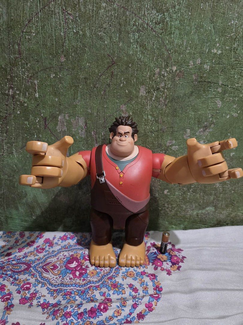 Authentic Disney Thinkway Wreck-It Ralph 11" Talking Action Figure (Category: Figurines & Statues) located in Lapu Lapu. Submitted by luckypenguin_01a640 (Listing ID 1453724609, Image 3). Description: Selling an authentic Disney Wreck-It Ralph Talking & Fist-Pounding Action Figure by Thinkway Toys. Large 11-inch scale collectible Ralph figure with articulated arms, hands, and head. Features smash-action triggers on the back that swing his fists a