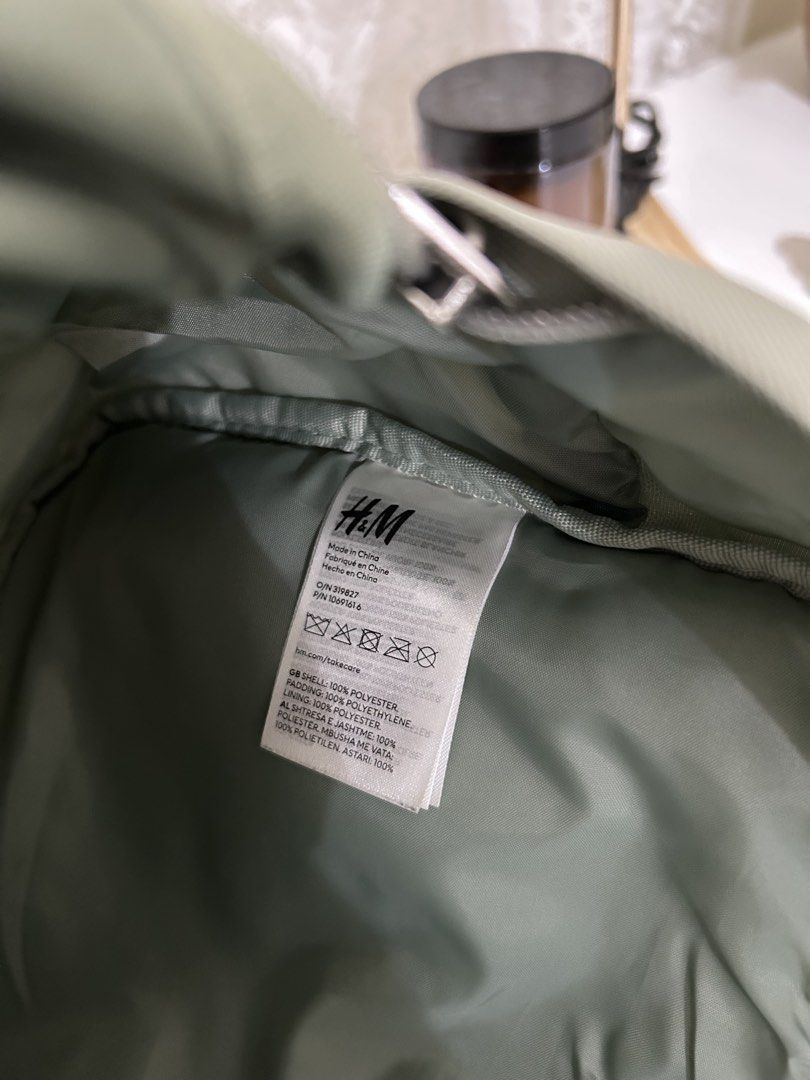 Authentic H&M Bunny Backpack (Category: Babies & Kids Fashion) located in Manila. Submitted by maison_marie (Listing ID 1453772510, Image 3). Description: Sage green backpack with front zip pocket for easy-access essentials. Side mesh pocket for a water bottle. Adjustable shoulder straps. Lightweight and perfect for toddlers or young kids. Condition: There is slight fading on the pink cheek details. Other than that, the bag is in good pre-loved c