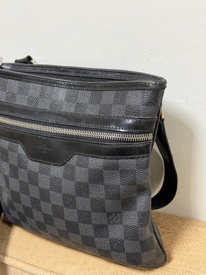 Authentic Louis Vuitton Damier Graphite Canvas Crossbody Bag (Category: Luxury Bags & Wallets) located in Manila. Submitted by useyourcommonsense (Listing ID 1453810273, Image 2). Description: - Authentic Louis Vuitton crossbody bag - Damier Graphite canvas - Front zipper pocket - Main compartment - Adjustable shoulder strap - Classic LV checkered pattern - Ideal for everyday use.