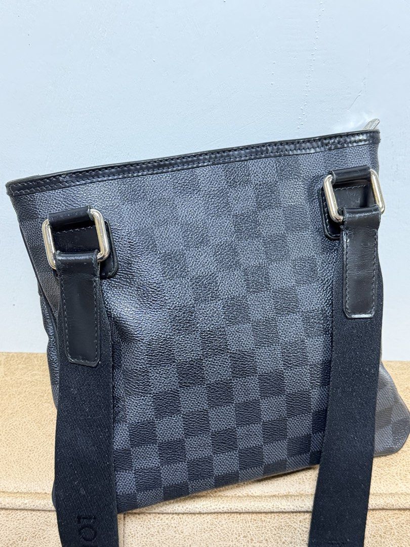 Authentic Louis Vuitton Damier Graphite Canvas Crossbody Bag (Category: Luxury Bags & Wallets) located in Manila. Submitted by useyourcommonsense (Listing ID 1453810273, Image 3). Description: - Authentic Louis Vuitton crossbody bag - Damier Graphite canvas - Front zipper pocket - Main compartment - Adjustable shoulder strap - Classic LV checkered pattern - Ideal for everyday use.