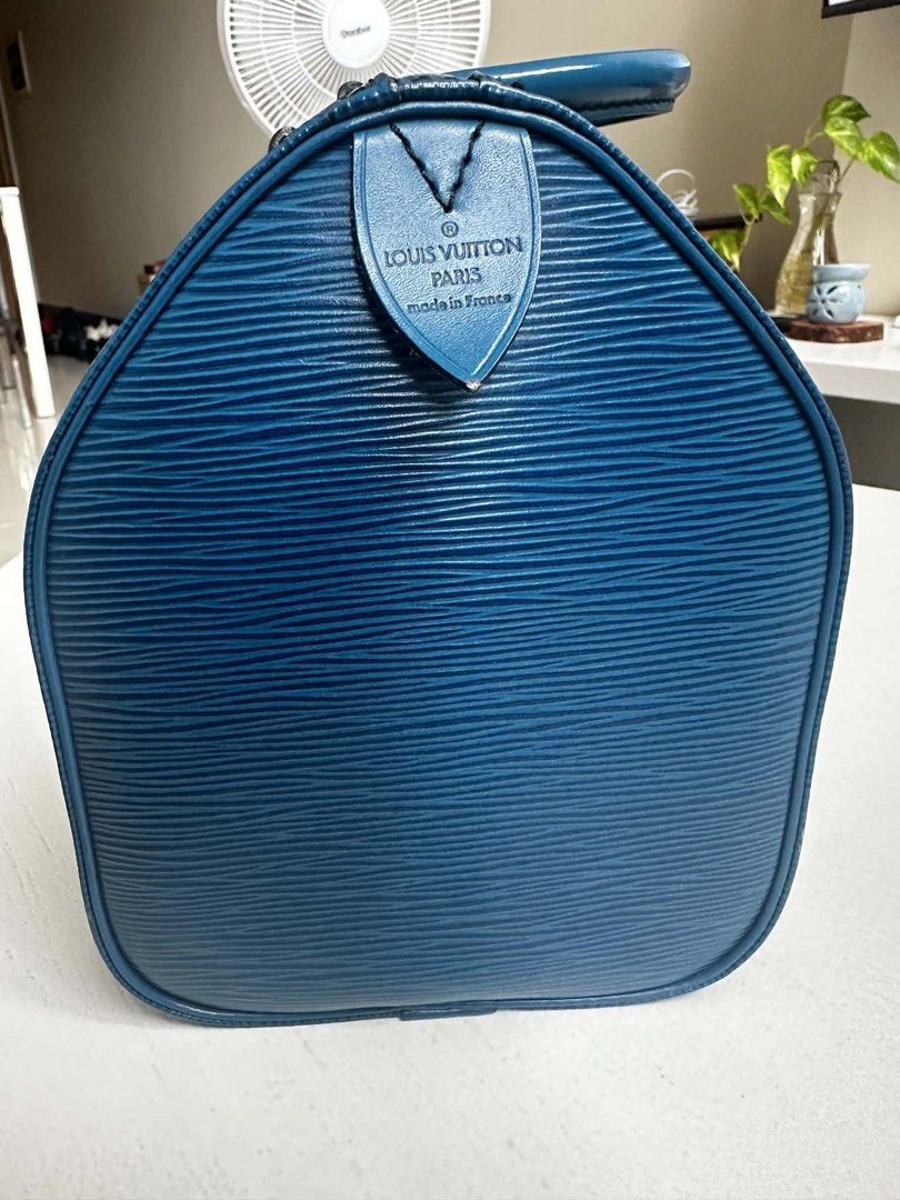 Authentic Louis Vuitton Epi Speedy Blue (Category: Luxury Bags & Wallets) located in Manila. Submitted by raidmyclosetmnl (Listing ID 1453657329, Image 3). Description: - Authentic Louis Vuitton Speedy 25 - Material: Epi leather - Color: Beautiful blue - Design: Classic and very spacious interior - Hardware: Gold tone - Includes: Leather clochette - Condition: Zipper works smoothly - Ideal for: Daily use or travel.