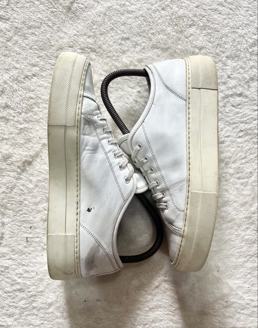 authentic Woman by Common Projects Tournament | Size 36 (Category: Sneakers) located in General Trias. Submitted by zrchustle.604 (Listing ID 1453702450, Image 3). Description: authentic Woman by Common Projects Tournament Low Super Platform Leather Sneakers in white leather. Key Product Details Brand: Common ProjectsModel: Tournament Low (Super Platform / Super Sole edition) Material: Premium Italian crafted calfskin leather with a tonal rubber 