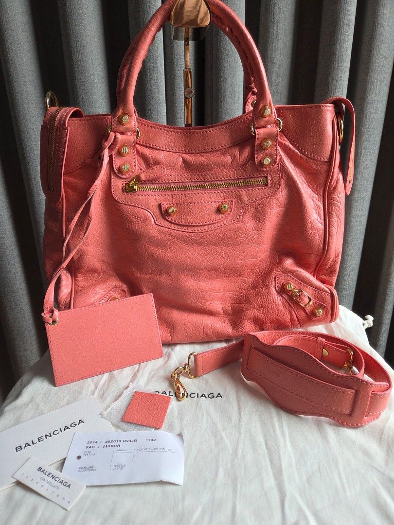 Balenciaga Velo Rose Azalee GHW (Category: Luxury Bags & Wallets) located in Quezon City. Submitted by shop.mar.go (Listing ID 1453663155, Image 1). Description: excellent condition Balenciaga Velo rose azalee (close to peach color) gold hardware inclusion posted in the 1st photo has minor dirt marks used few times only still clean and no foul smell..