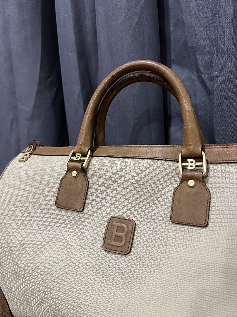 Bally Vintage Boston Bag (Category: Luxury Bags & Wallets) located in Batangas. Submitted by thegudoldays (Listing ID 1453760552, Image 2). Description: This is a vintage Bally B-logo monogram boston bag made of canvas and leather. Details and issues posted. (on pics) Condition 8/10 Good condition (easy to restore) Need wash ₱2500 only.