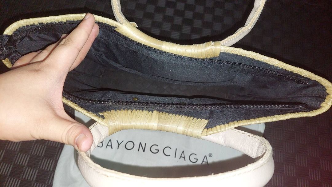 Bayongciaga Woven Tote Bag (Category: Tote Bags) located in Pasig City. Submitted by calmdragon (Listing ID 1453754909, Image 3). Description: - Chic woven tote bag - Features elegant purple and gold stripes - Comfortable round handles - Secure zipper closure inside - Comes with a protective dust bag - Ideal for everyday errands or beach getaways.