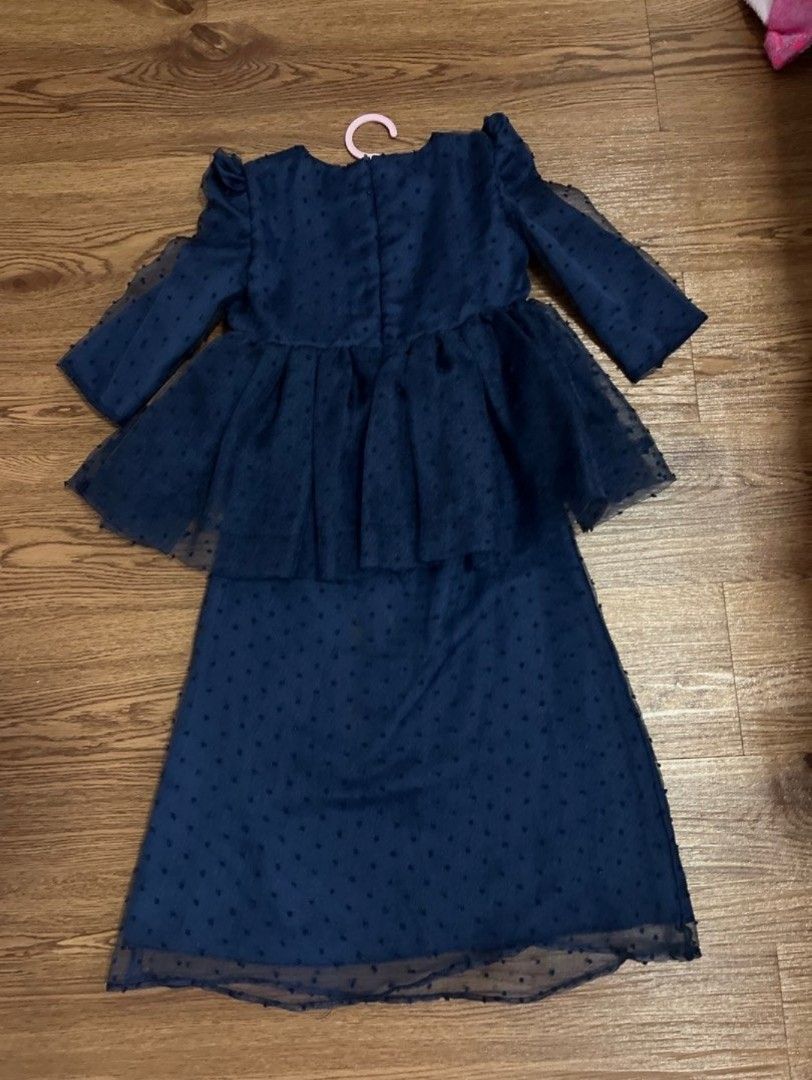 Bbd (Category: Babies & Kids Fashion) located in Nusajaya. Submitted by mybajupreloved (Listing ID 1453647891, Image 3). Description: - Adorable navy blue outfit for girls. - Features a charming swiss dot pattern. - Top with stylish puff sleeves and a peplum hem. - Comes with matching flared pants. - Versatile for parties or everyday casual wear. - Comfortable and fashionable design..