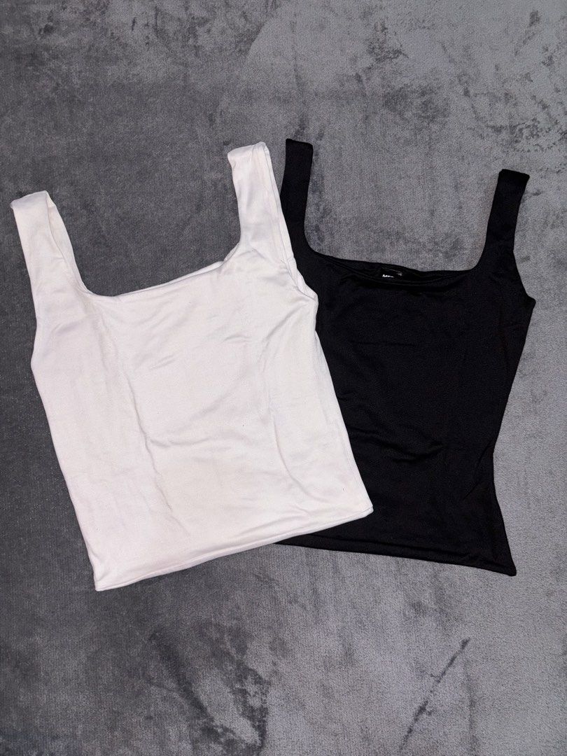 Black and White Square Neck Tank Tops (Category: Sleeveless) located in Manila. Submitted by _closetcleanup (Listing ID 1453775905, Image 2). Description: - Set of 2 basic tank tops - Colors: Black and White - Features a stylish square neckline - Designed with comfortable thick straps - Made from stretchy material for a great fit - Versatile pieces: wear them on their own or layer them.