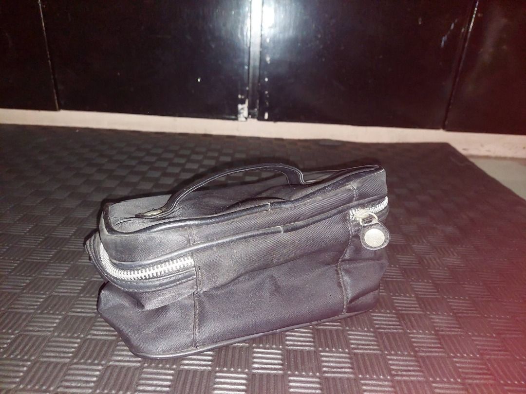 Black Cosmetic Bag with Handle and Zipper (Category: Luxury Bags & Wallets) located in Pasig City. Submitted by calmdragon (Listing ID 1453759038, Image 1). Description: - Sleek black cosmetic bag - Easy-carry top handle - Secure zipper closure - Ideal for travel or everyday use - Simple and practical design.
