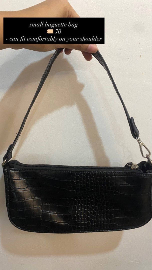 Black Croc Embossed Small Baguette Bag (Category: Shoulder Bags) located in Bulacan. Submitted by hellosofiaaa (Listing ID 1453759983, Image 1). Description: - Small black baguette bag - Croc embossed texture - Comfortable shoulder fit - Secure zipper closure - Simple and chic for everyday use - Ideal for carrying essentials.