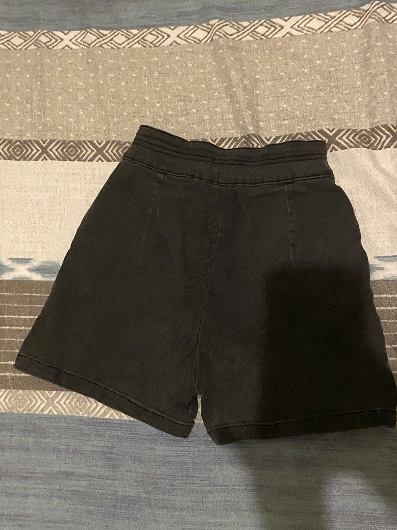 Black High Waisted Shorts Size S (Category: Shorts) located in Tanauan. Submitted by rie098 (Listing ID 1453734117, Image 2). Description: - Color: Black - Style: High-waisted shorts - Closure: Button and zip front - Pockets: Two front pockets - Occasion: Casual wear - Features: Simple and classic design.