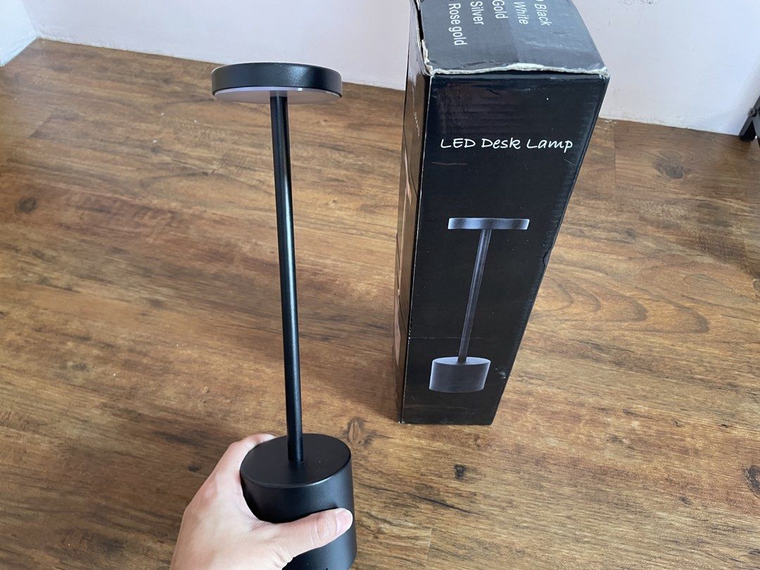 Black LED Desk Lamp (Category: Lighting) located in Manila. Submitted by nextowner.zip (Listing ID 1453660406, Image 2). Description: - Sleek minimalist black LED desk lamp - Wire-free and battery-powered for ultimate convenience - Ideal for reading or working in low light - Comes in its original packaging.