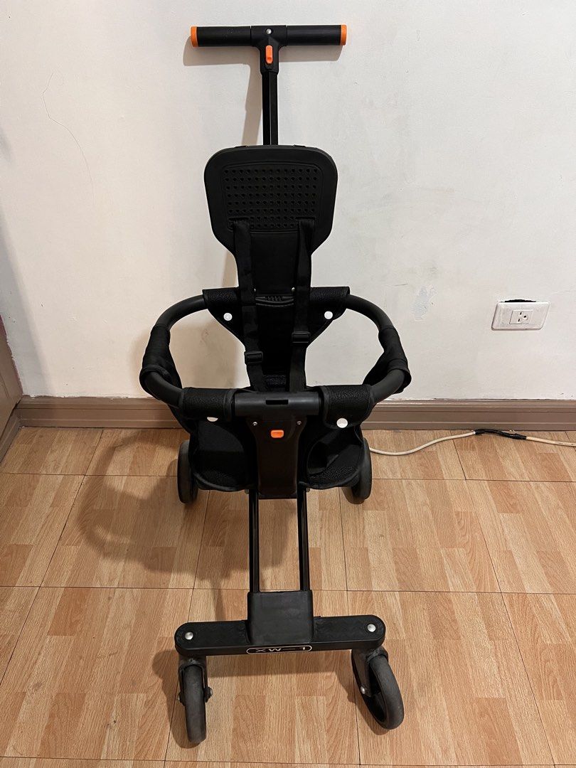 Black Lightweight Compact Stroller with Orange Accents (Category: Strollers) located in Quezon City. Submitted by handmedownbyluna (Listing ID 1453768532, Image 2). Description: - Lightweight and compact black stroller - Easy one-hand fold for convenience - Secure 5-point harness for child's safety - Ideal for travel and everyday outings - Bought in SM Preloved Baby Stroller – Very Good Condition Selling our preloved baby stroller. Still in very 