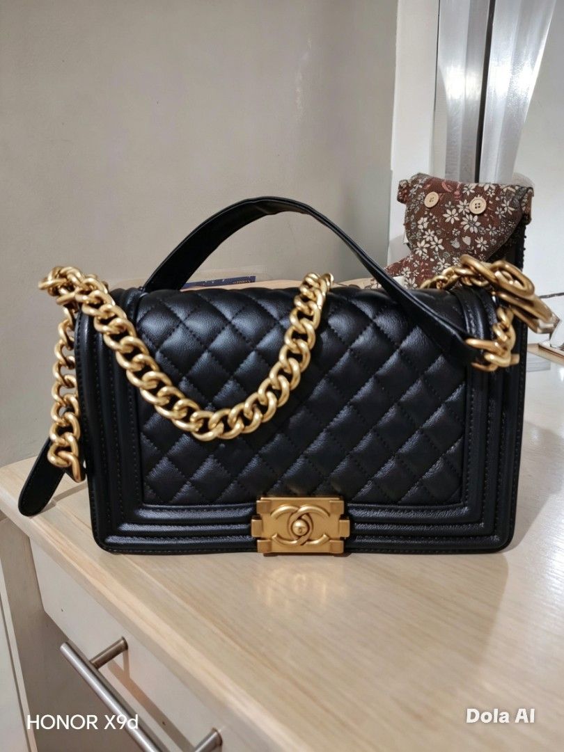 Black Quilted Handbag with Gold Chain (Category: Luxury Bags & Wallets) located in Manila. Submitted by cupcak305 (Listing ID 1453735984, Image 1). Description: -with Dust bag - Black quilted handbag - Gold chain strap - Gold turn-lock closure with Chanel logo - Top handle for carrying - Classic, versatile style for day or night Negotiable.
