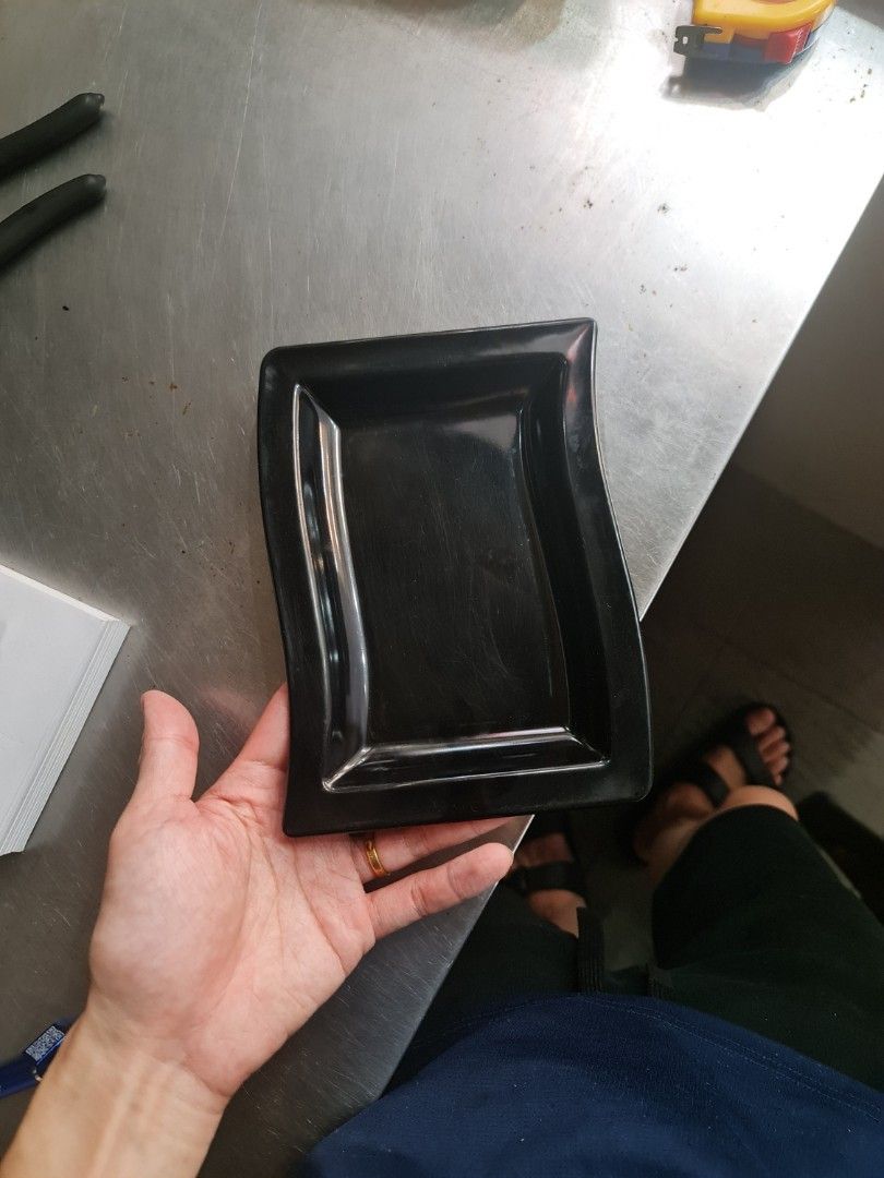 Black rectangular wavy serving dish (Category: Dinnerware & Cutlery) located in Singapore. Submitted by mrlawrencekel (Listing ID 1453735856, Image 1). Description: qty :30 dimension- 20cm x 14 cm self collection at bedok 416 coffeeshop.