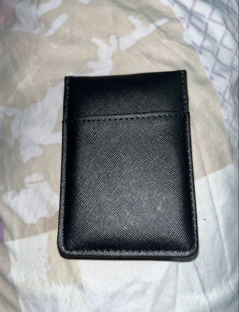 Black Wallet with Money Clip (Category: Wallets & Card Holders) located in Taguig. Submitted by mafrd (Listing ID 1453717751, Image 1). Description: - Black card holder - Features a built-in metal money clip - Comes with a blue card displaying the 'AXCS' logo - Slim and compact design for easy portability.