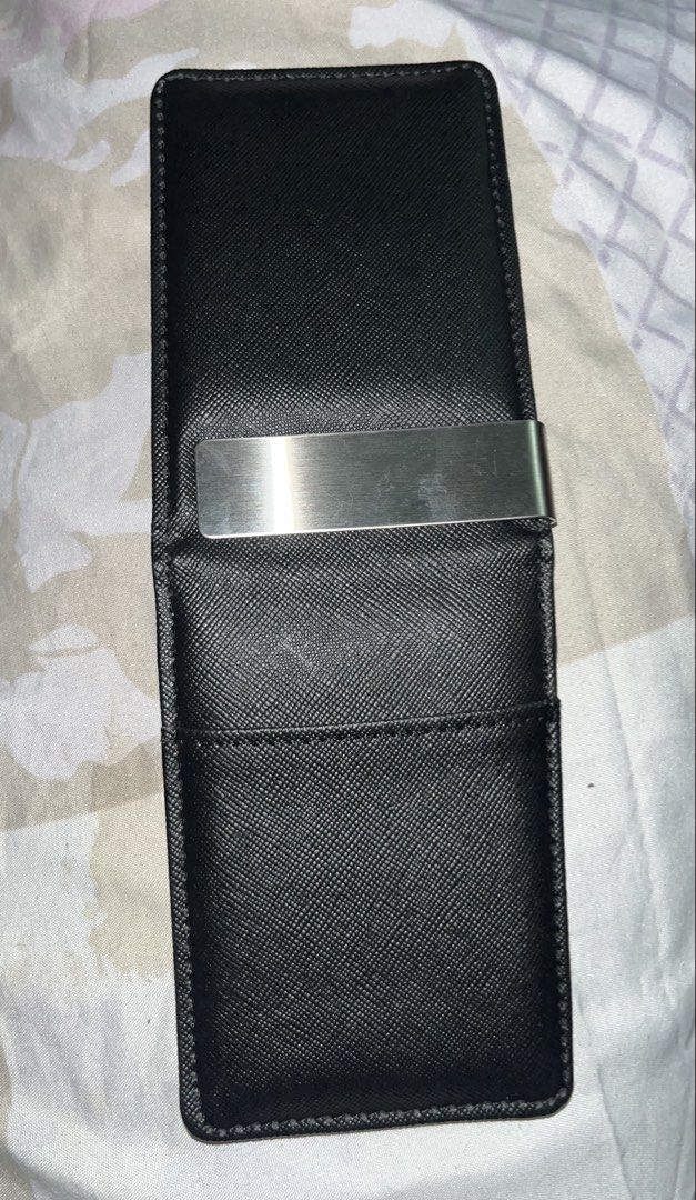 Black Wallet with Money Clip (Category: Wallets & Card Holders) located in Taguig. Submitted by mafrd (Listing ID 1453717751, Image 3). Description: - Black card holder - Features a built-in metal money clip - Comes with a blue card displaying the 'AXCS' logo - Slim and compact design for easy portability.
