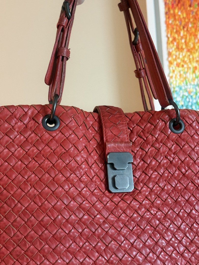 Bottega Venetta Capri (Category: Luxury Bags & Wallets) located in Makati City. Submitted by markussangabriel (Listing ID 1453727561, Image 2). Description: - Unique red woven leather tote bag - Features a distinctive weave pattern - Secure clasp closure at the top - Comfortable straps for easy carrying - Perfect size for daily essentials - Adds a stylish touch to any outfit.