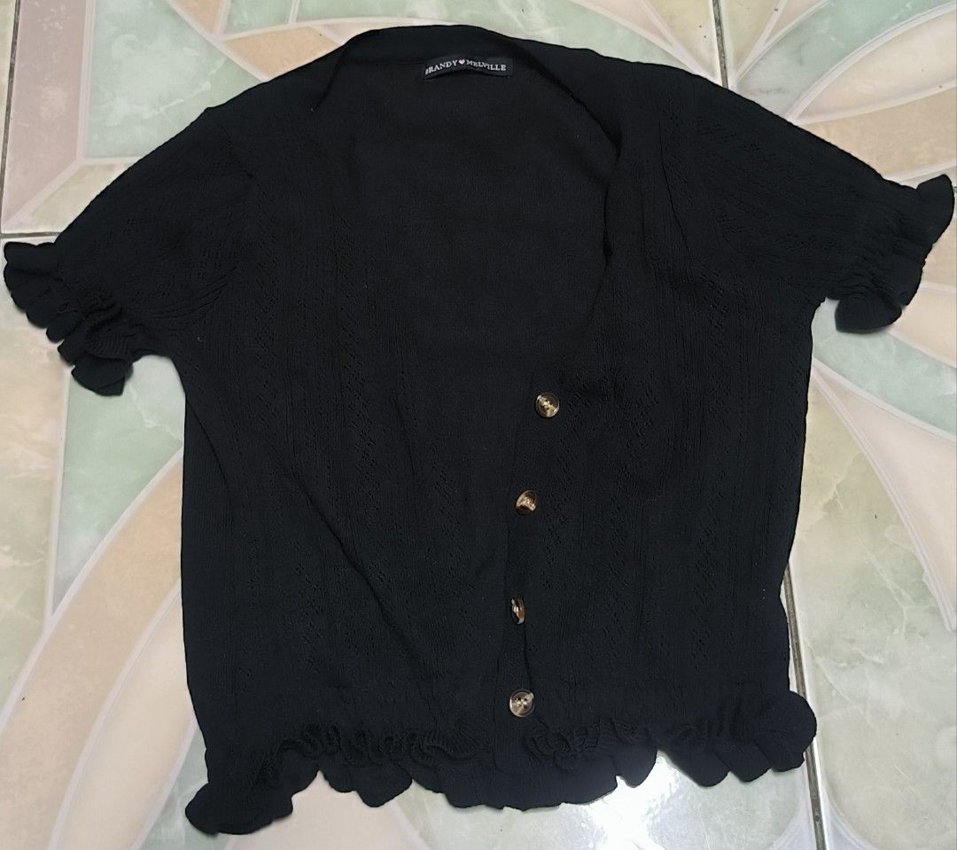 Brandy Melville Zoa mini Cardigan (Category: Coats, Jackets and Outerwear) located in Manila. Submitted by itsmelawrence (Listing ID 1453791318, Image 3). Description: - Black Brandy Melville - Short sleeves with ruffled cuffs - Ruffled hemline - Button up front - Made in Italy - 100% Cotton -size small 14x15.