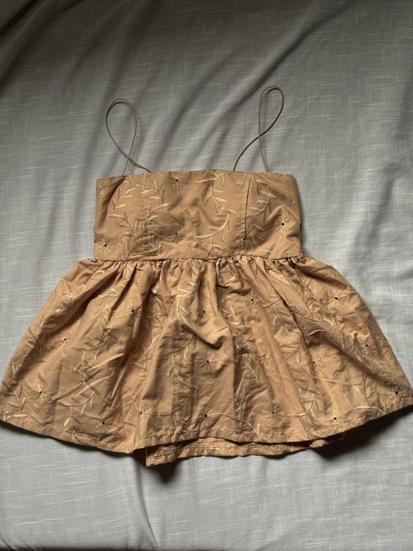 Brown Padded Embroidered Camisole Top with Spaghetti Straps (Category: Sleeveless) located in Manila. Submitted by aira_caeli (Listing ID 1453806749, Image 2). Description: - Cute brown camisole top - Features all-over floral embroidery - Square neckline with thin spaghetti straps - Empire waist with a gathered, flared hem - Versatile for pairing with jeans or skirts - Size: Large (US 8 / UK 12 / EU 40).
