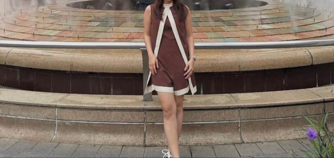 Brown Sleeveless Romper with Cream Trim (Category: Rompers) located in Manila. Submitted by bridetobe018 (Listing ID 1453679260, Image 1). Description: - Sleeveless romper in a rich brown color. - Unique cream trim detail around the neckline and down the front. - Flattering and modern cut. - Versatile piece for chic, put-together looks. - Shein Selianne Women's Minimalist Elegant Color Blocking Cape Romper - Easy to style up or down..