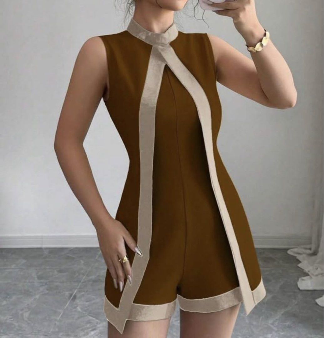 Brown Sleeveless Romper with Cream Trim (Category: Rompers) located in Manila. Submitted by bridetobe018 (Listing ID 1453679260, Image 2). Description: - Sleeveless romper in a rich brown color. - Unique cream trim detail around the neckline and down the front. - Flattering and modern cut. - Versatile piece for chic, put-together looks. - Shein Selianne Women's Minimalist Elegant Color Blocking Cape Romper - Easy to style up or down..