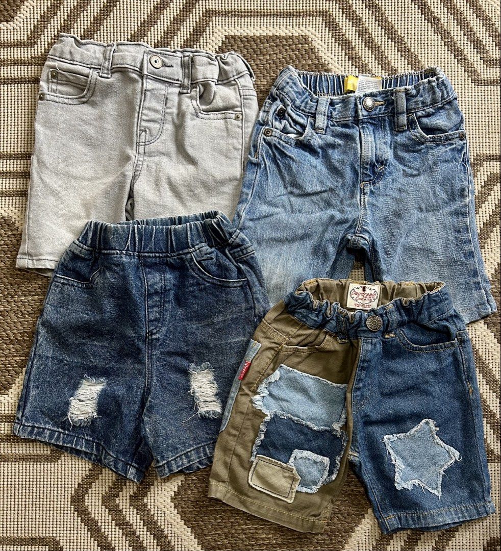 Bundle of 4 Boys' Denim Shorts (Category: Babies & Kids Fashion) located in Santa Rosa. Submitted by lovedbydane (Listing ID 1453688906, Image 1). Description: - Set of 4 boys' shorts - Includes light grey denim shorts - Features distressed blue denim shorts with rips - One pair with patchwork and star detail - All shorts have comfortable elastic waistbands - Ideal for everyday wear and playtime 2T on tag .