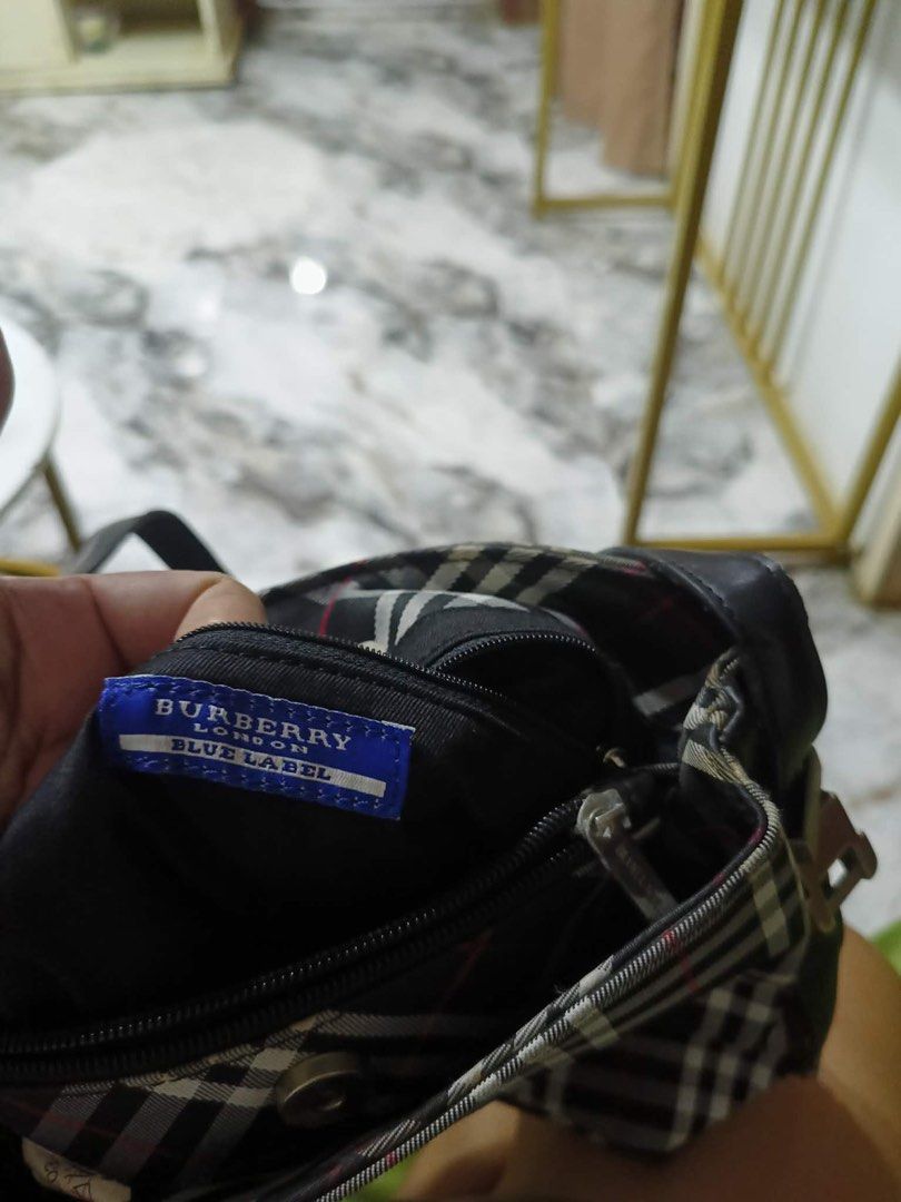 Burberry Blue Label Nova Check Shoulder Bag (Category: Luxury Bags & Wallets) located in Kibawe. Submitted by jeloots (Listing ID 1453763310, Image 2). Description: - Authentic Burberry Blue Label shoulder bag - Iconic Nova Check pattern (black, white, red plaid) - Genuine leather strap and trim - Interior: zippered pocket and main compartment - Ideal for everyday use.