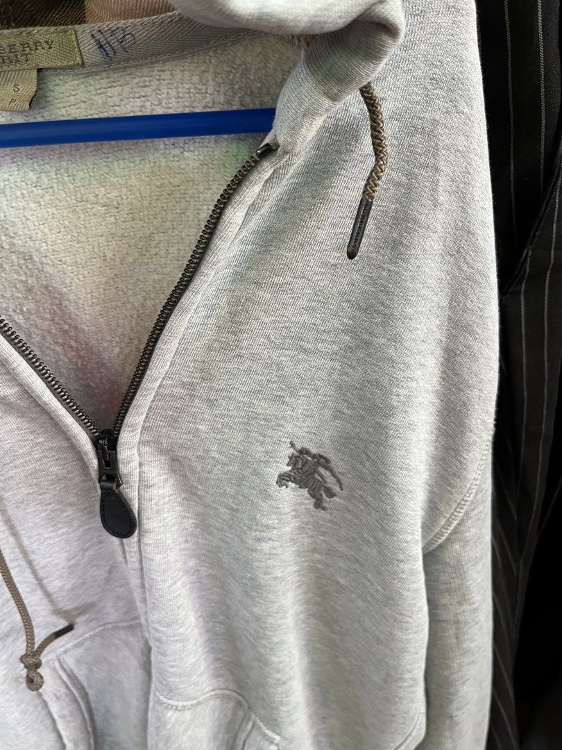 Burberry Grey Full Zip Flannel Hood (Category: Hoodies) located in Iligan City. Submitted by thrift.homie9200 (Listing ID 1453708714, Image 2). Description: SMALL ON TAG (POSSIBLE 19-21 Width and 27-29 Length) GOOD CONDITION COLOR RATE: 9/10 ISSUE: LINTS FOR SAFE, NEEDWASH, AND MINIMAL TATTERING IN RIBBING.